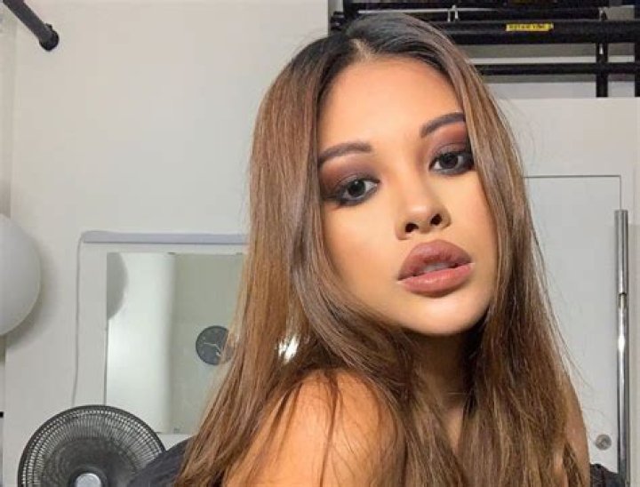 Ammika Harris Is Showing Off A Lot Of Tanned Skin In This Exotic White Outfit