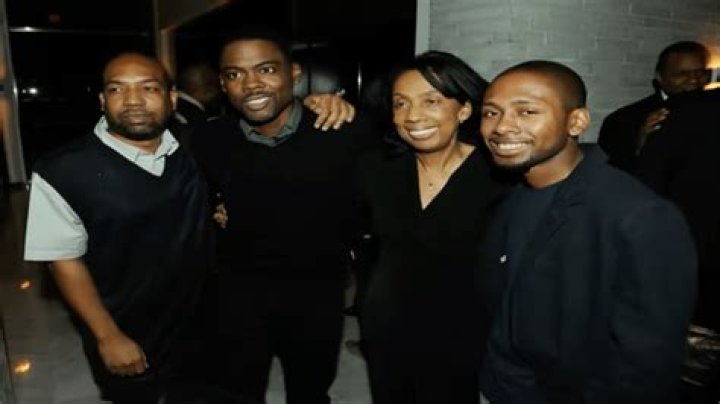 How many siblings does Chris Rock have and are any of his brothers and sisters famous?
