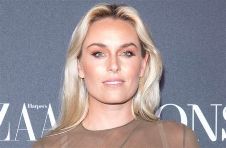 Lindsey Vonn in Orange Leggings Lifts Weights and Works Out 